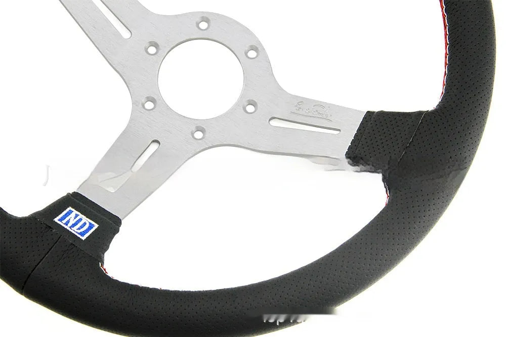 Leather-wrapped 14-inch steering wheel with concave centre and silver metal skeleton frame