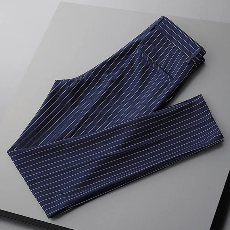 Men's thin striped loose suit pants with draping fit in black and white colours.