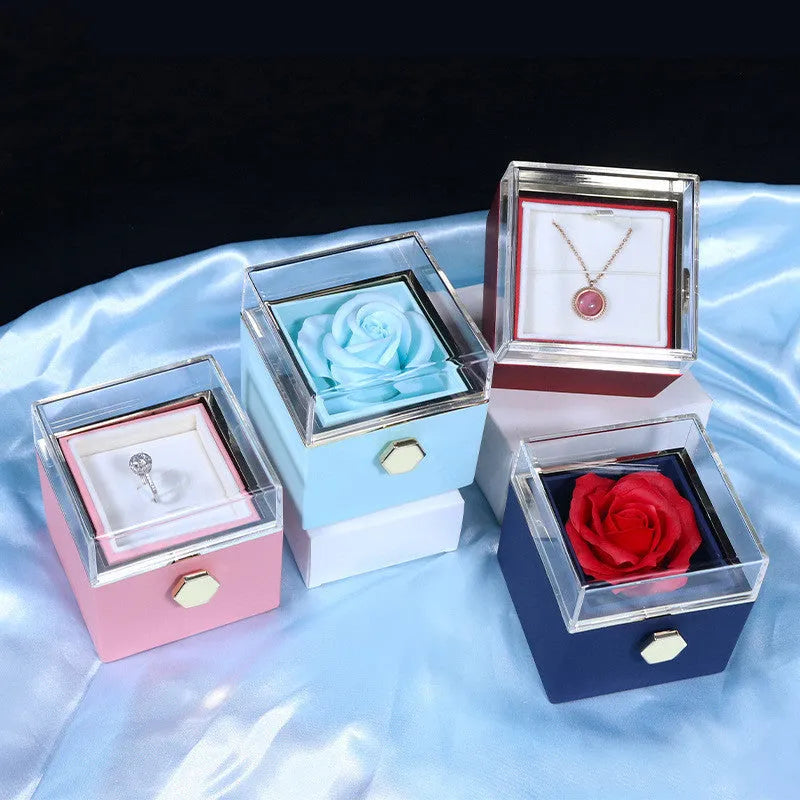 Rotating drawer jewellery gift box with preserved red rose under clear acrylic dome.