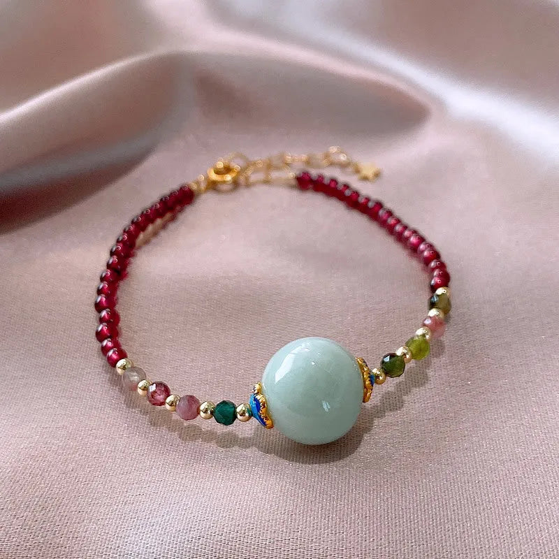 Women's aquamarine and garnet bracelet with drop shape stones and electroplated tourmaline elements