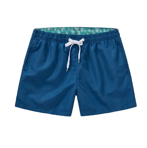 Men's straight leg beach shorts in polyester fabric available in multiple colours and sizes