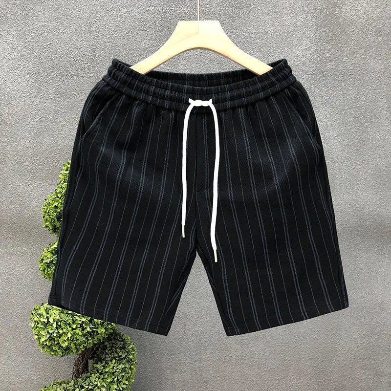 Black and white striped men's casual fleece-lined shorts with an elastic waistband.
