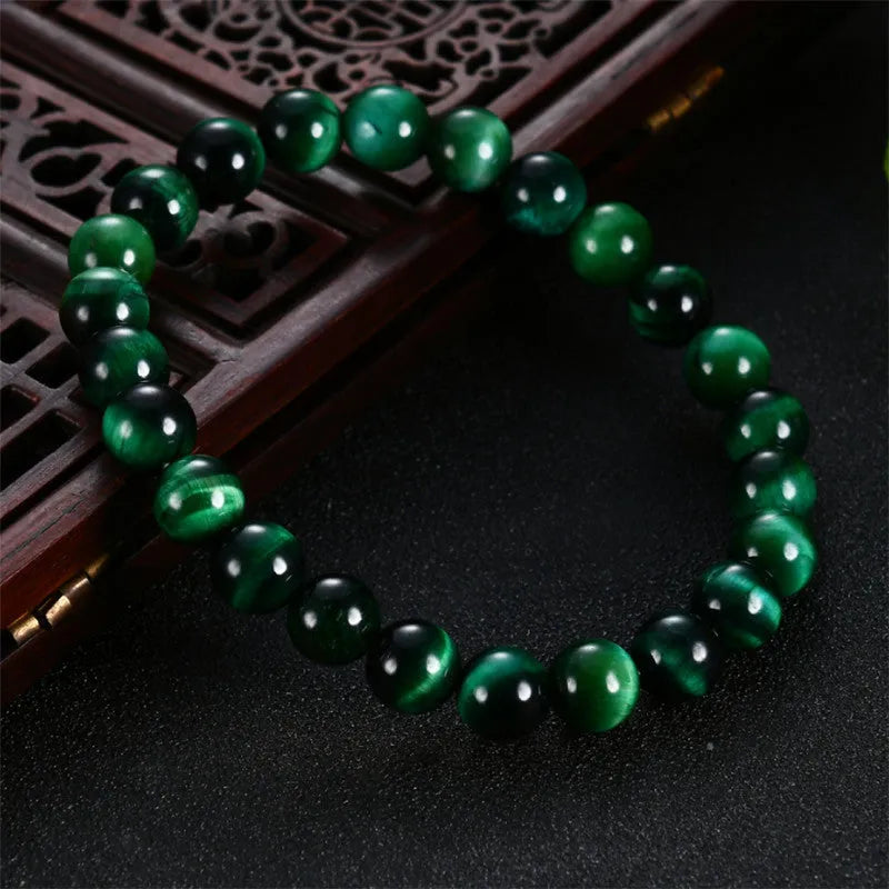 Green Tiger Eye stone bracelet with polished geometric beads in various sizes