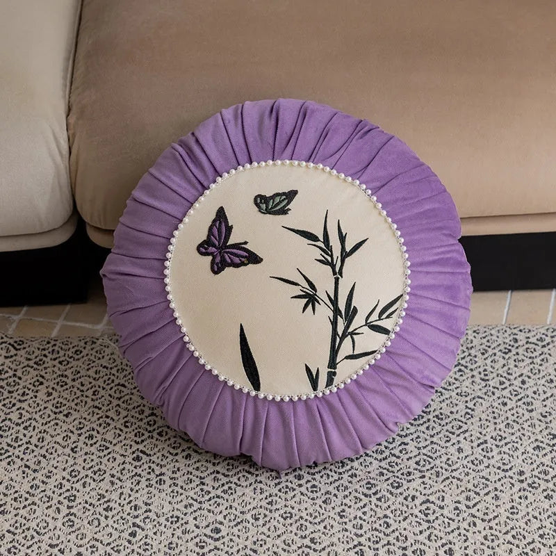 Square beige cushion with detailed Chinese butterfly embroidery design.