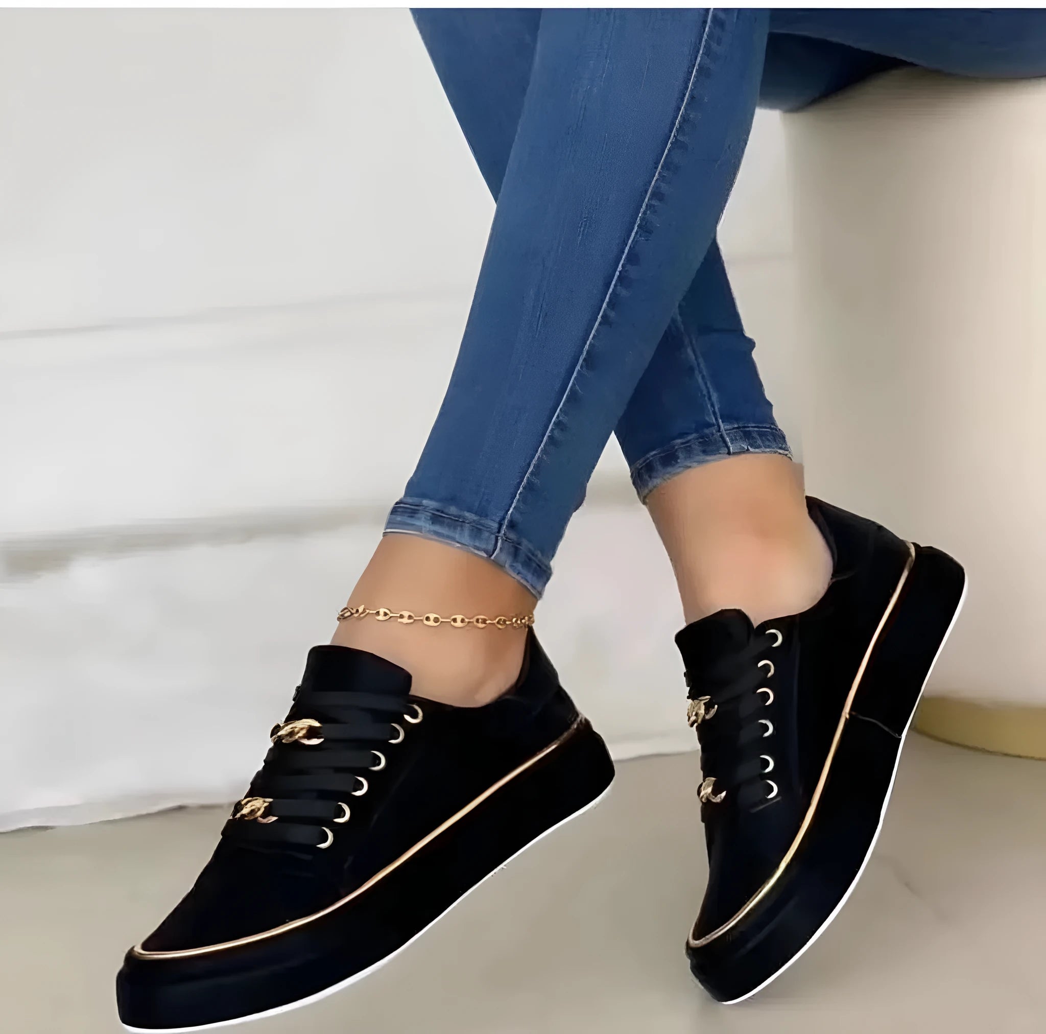Women's platform chain low-top sports shoes in black with patent artificial PU upper, flat heel, and metal chain detail