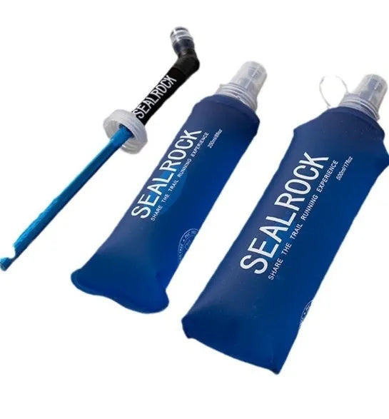 Grey portable water filter straw with textured grip and long flexible silicone tube, shown with a carabiner clip.