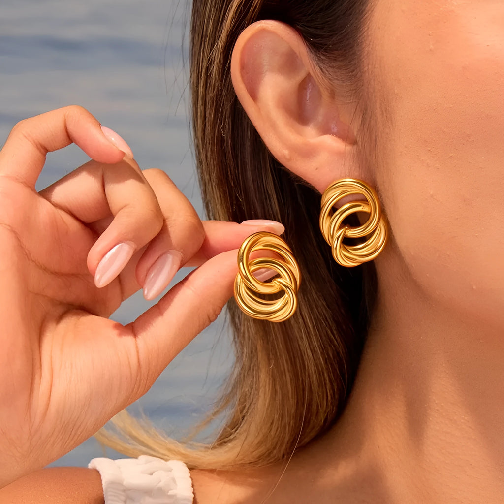 18K gold electroplated stainless steel geometric circle stud earrings on display