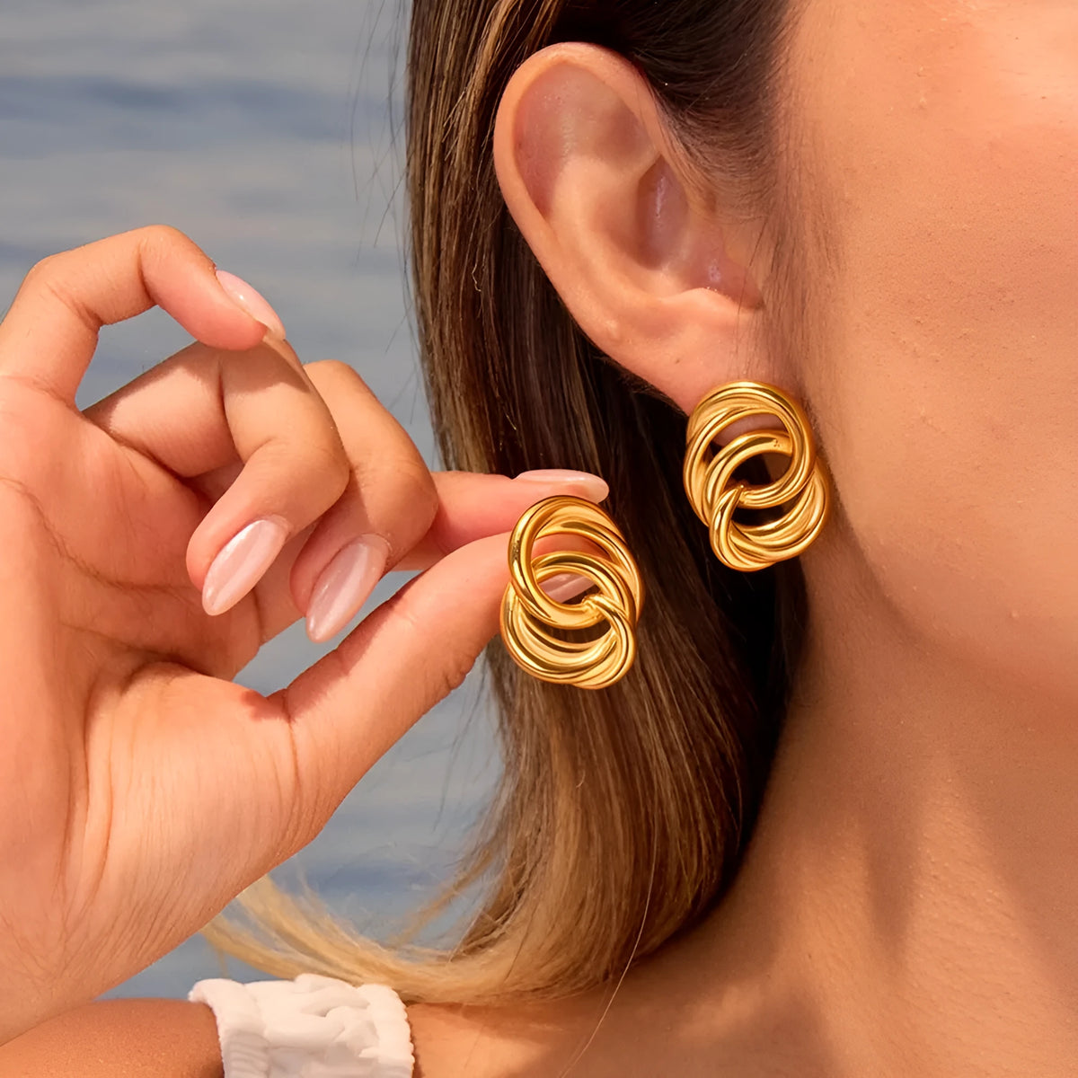 18K gold electroplated stainless steel geometric circle stud earrings on display