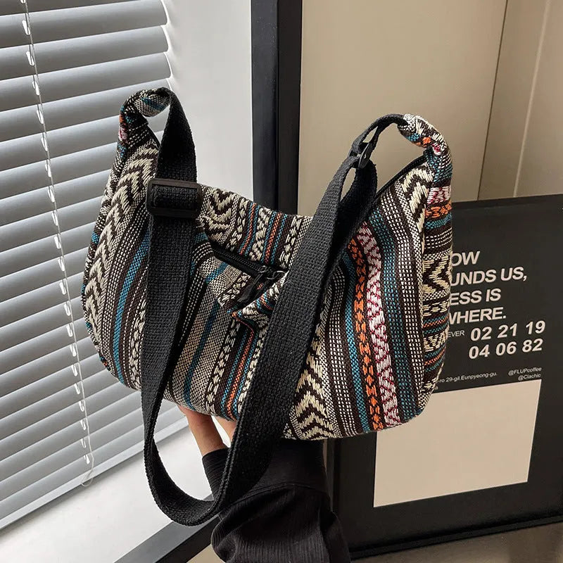 Women's ethnic style canvas dumpling crossbody bag showing sewing thread details and large capacity design