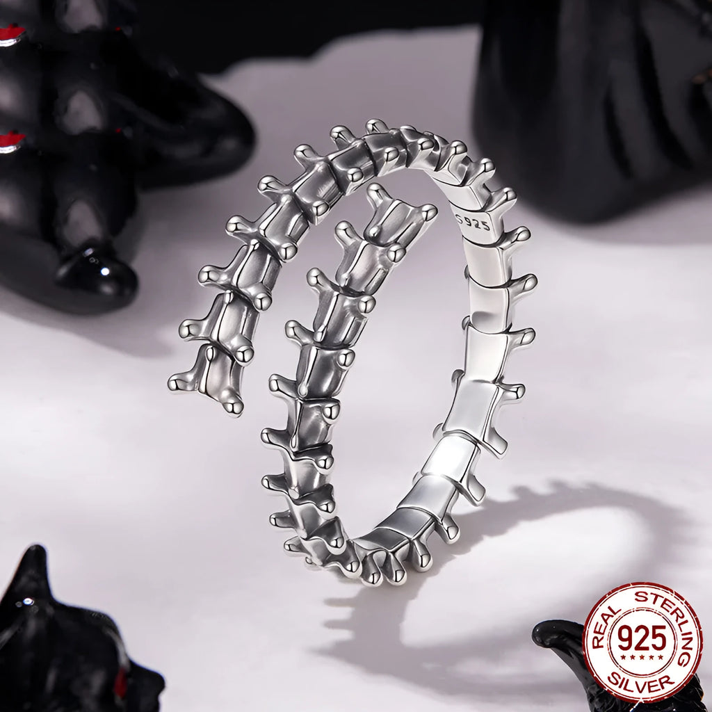 Women's silver tone adjustable backbone open ring with pumpkin skull motif on black background