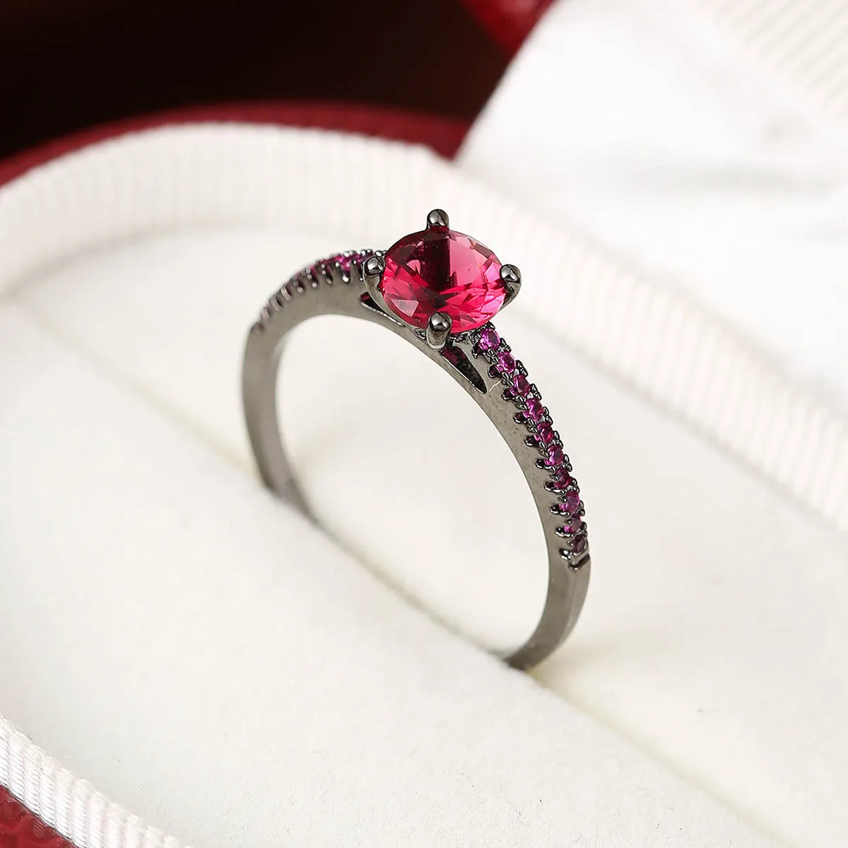 Copper zircon hexagonal geometric ring in a gold rose red electroplated finish.