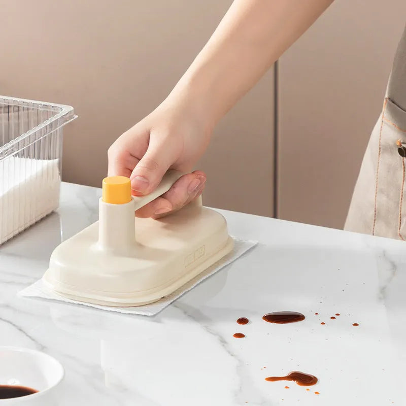 Magic Brush cleaning tool with disposable white rag heads for bathroom tile and glass cleaning.