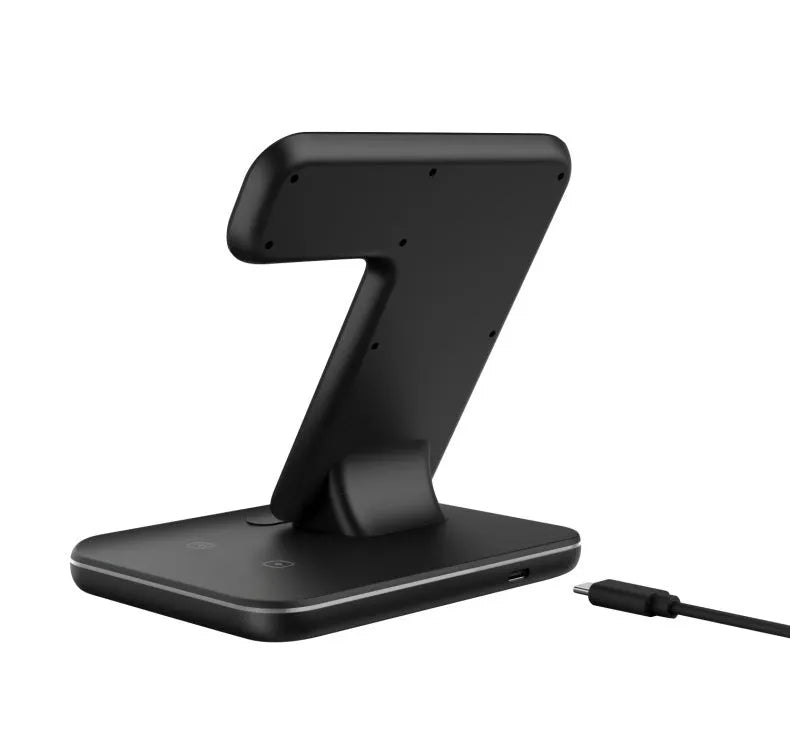 White 15W three-in-one wireless charging stand for mobile phone, smartwatch and headset on a desk.