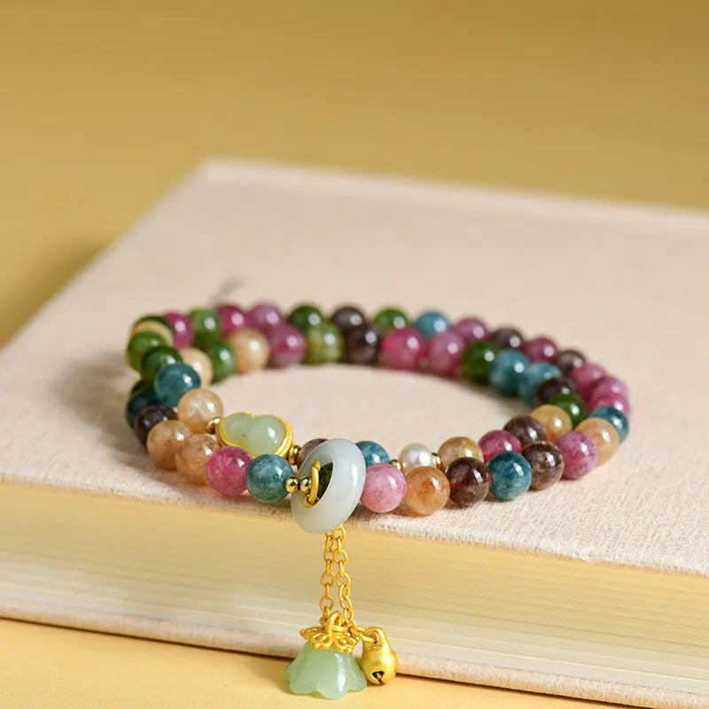 Close-up of a women's double ring bracelet made from round natural chalcedony crystal beads.