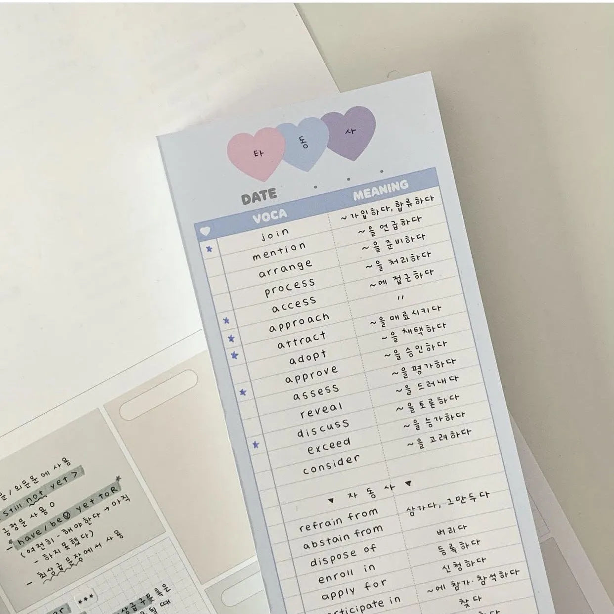 Vertical B5 half-size notepad in blue, pink, or purple cover, showing double-sided pages.