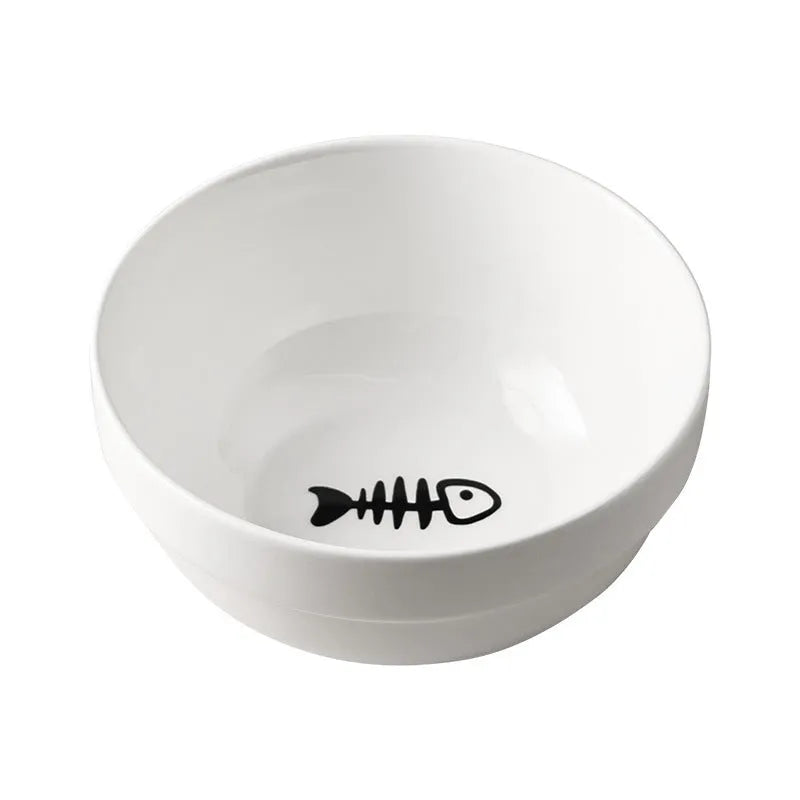 White ceramic cat bowl with cat footprint design on a black iron stand with cat ears.