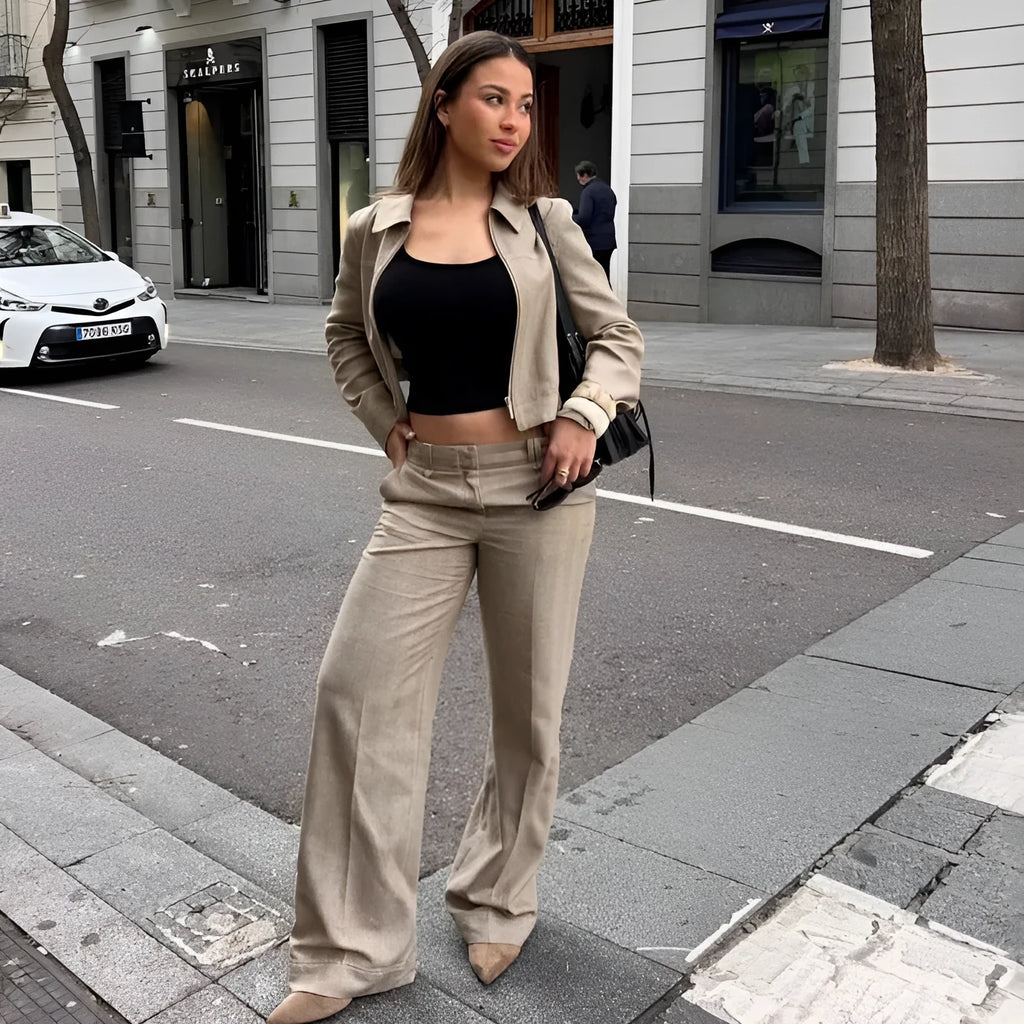 Women's black polyester suit set with 3D herringbone pattern and embroidery, showing jacket and trousers.