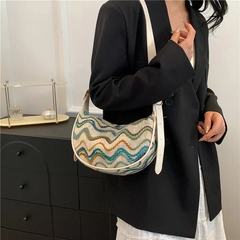 Women's woven straw crossbody bag with internal phone compartment and file storage