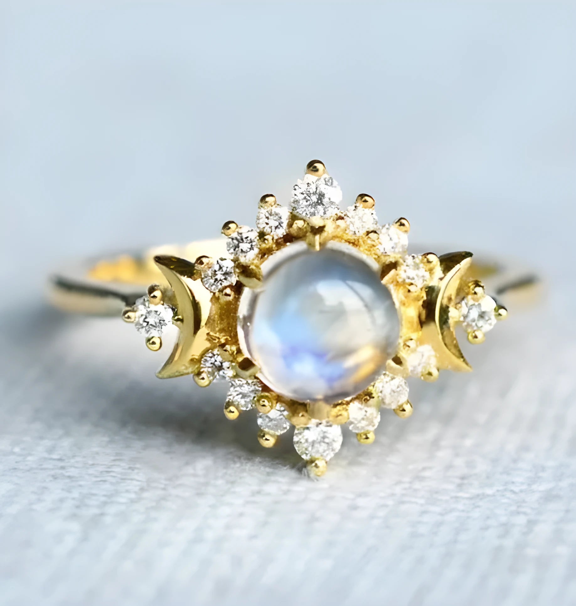 Five stackable fashion rings in gold and rose gold finishes on a white background