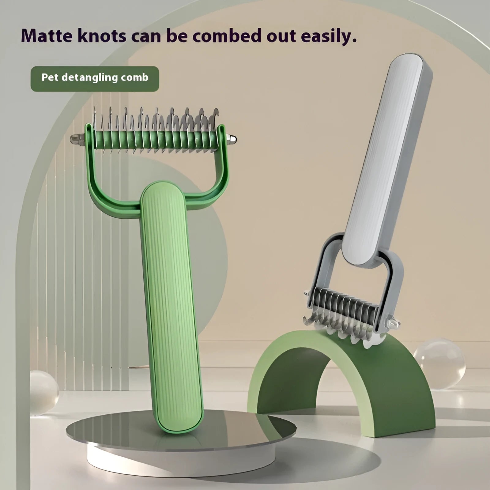 Green and grey dog unknotting comb with stainless steel teeth and PP plastic handle.