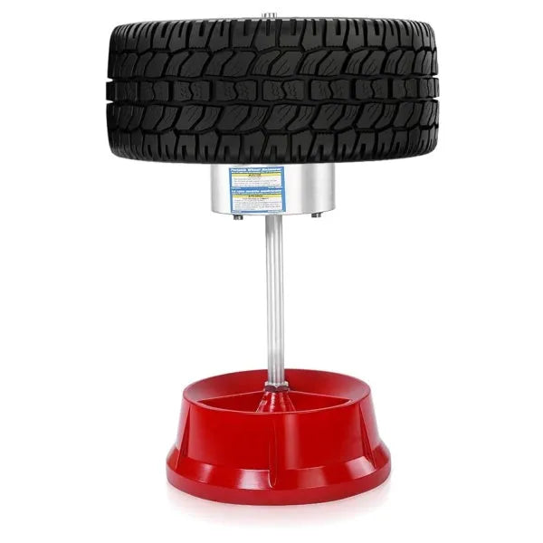 Portable wheel hub balancer with aluminium head and bull's eye level on an enamel base.