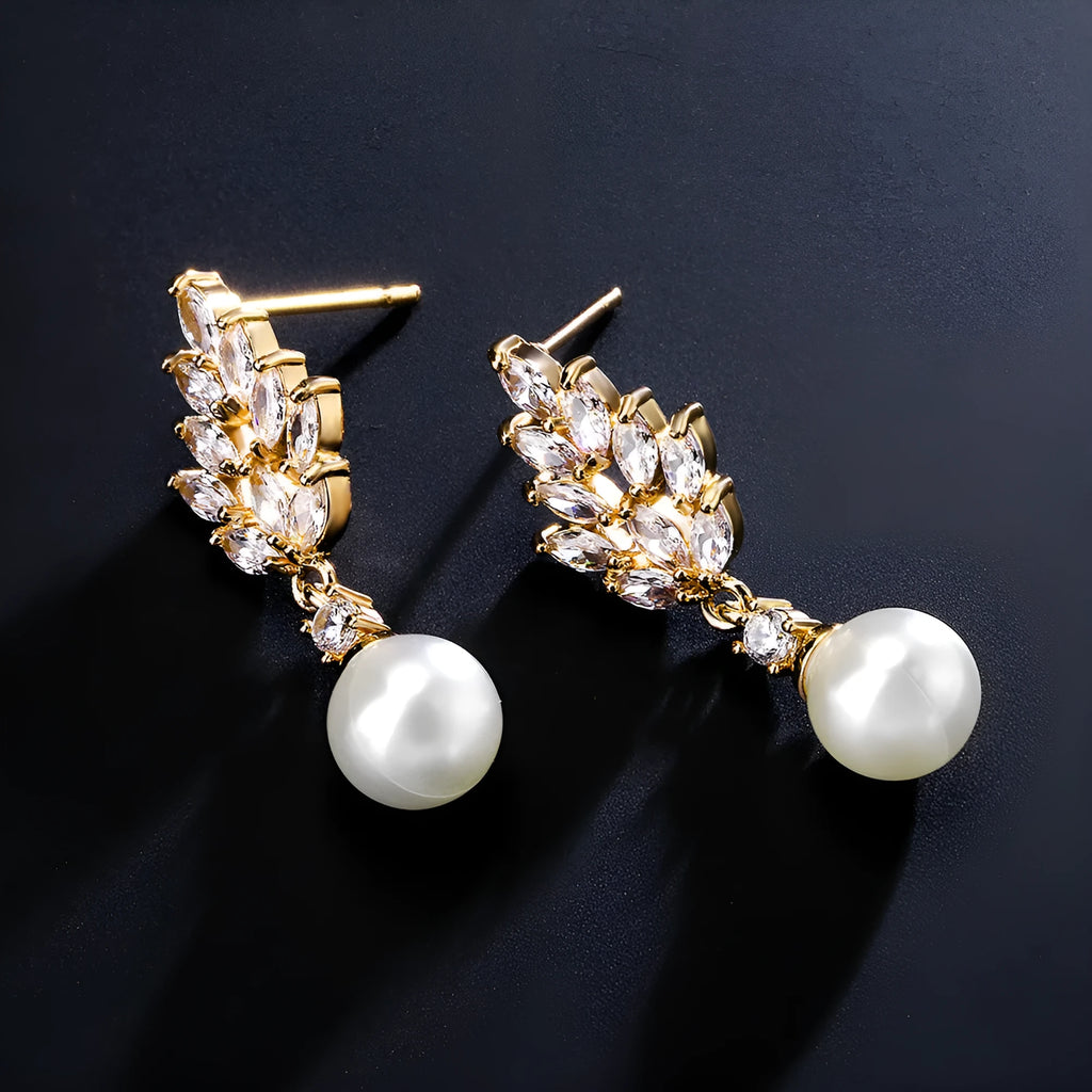 Geometric flower earrings with micro inlaid zircon in gold, rose gold, and white gold plated finishes.
