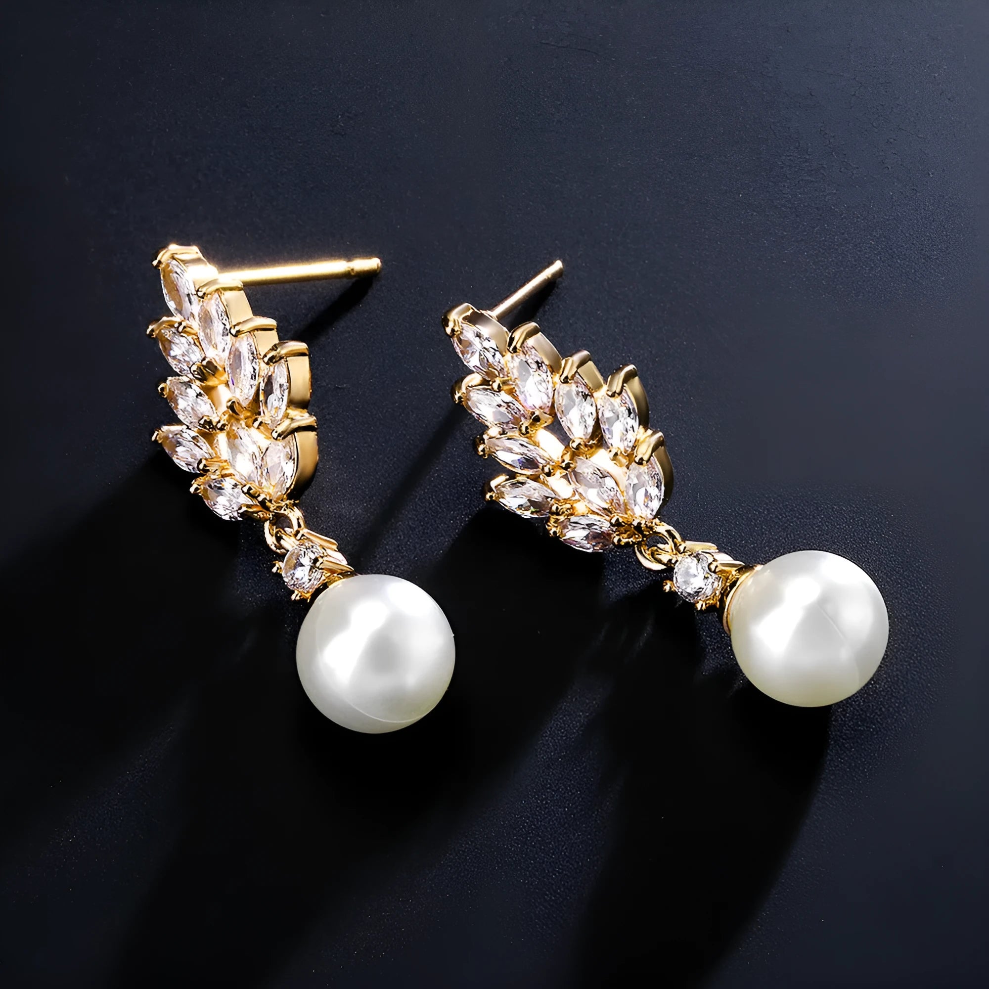 Geometric flower earrings with micro inlaid zircon in gold, rose gold, and white gold plated finishes.