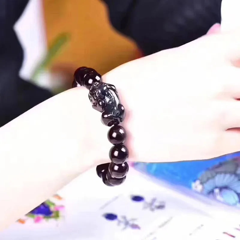 Natural ice colour obsidian crystal bracelet showing different bead size options on a wrist.