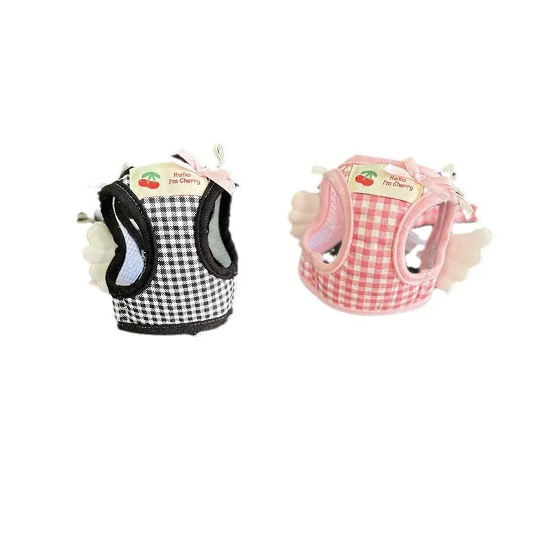 Pink cotton chest and back hand holding rope harness for a small dog on a white background.