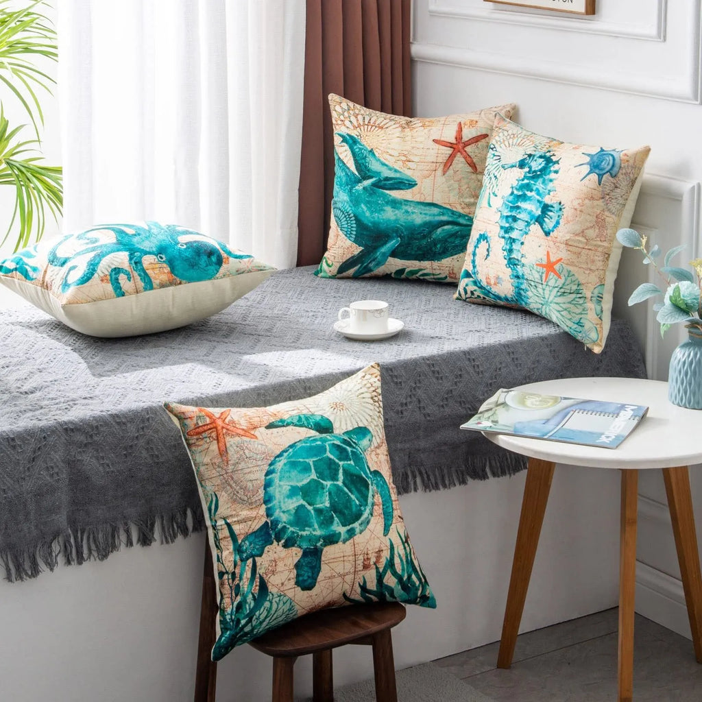 Linen cushion cover with detailed sea turtle print, measuring 45x45cm, on a sofa.