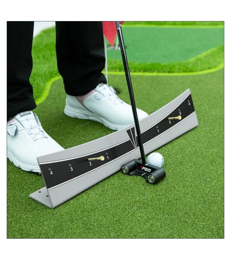 Golf putter with attached adjustable balance simulator showing the extended push rod mechanism on a putting mat.
