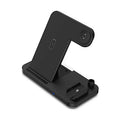 Black four-in-one wireless phone charger with QC3.0 fast charging head on desk