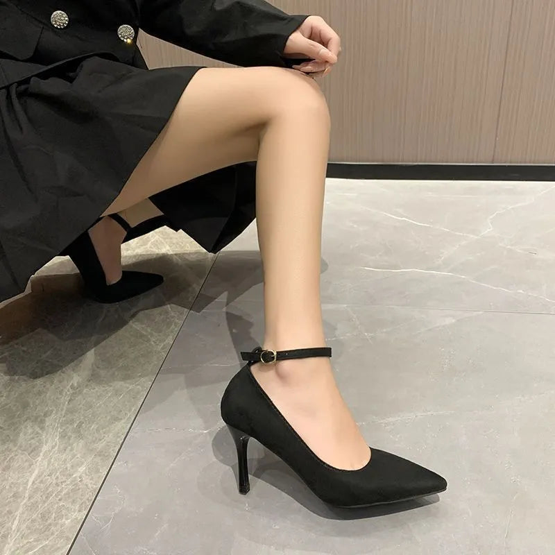 Women's black and creamy white stiletto heel shoes with buckle detail for graduation photos