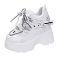 White and black women's mesh platform sports shoes with a cross strap and 6-8cm heel.