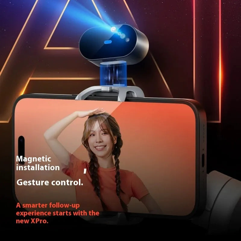 Black mobile phone stabilizer PTZ gimbal with AI tracking module and tripod on a flat surface