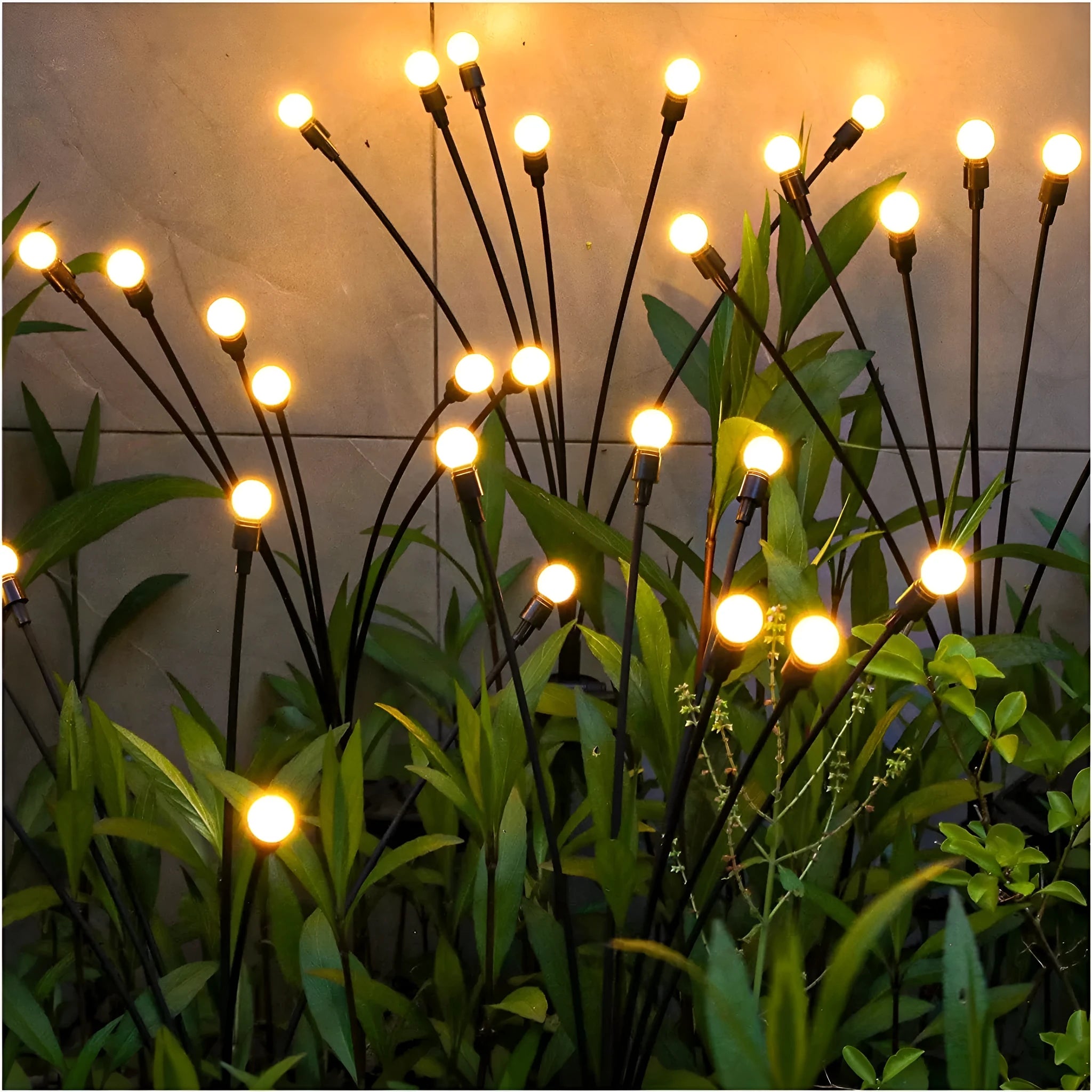 Solar-powered LED garden spike light with multiple glowing heads and a metal ground plug inserted in soil at dusk.