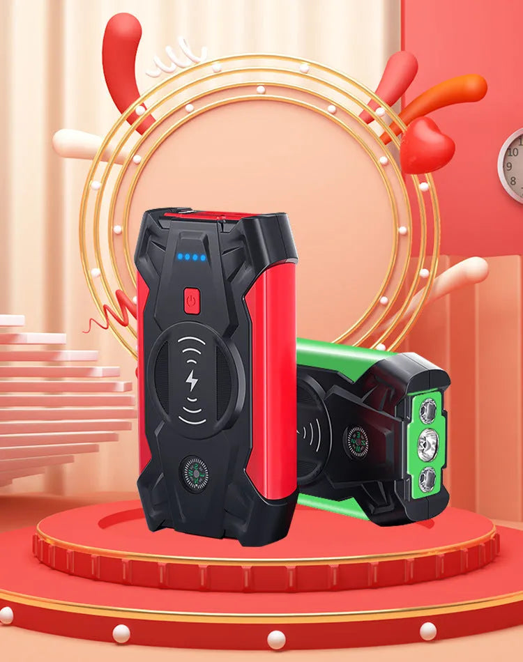 Red 12V car battery jump starter power pack with battery clips on a black background.