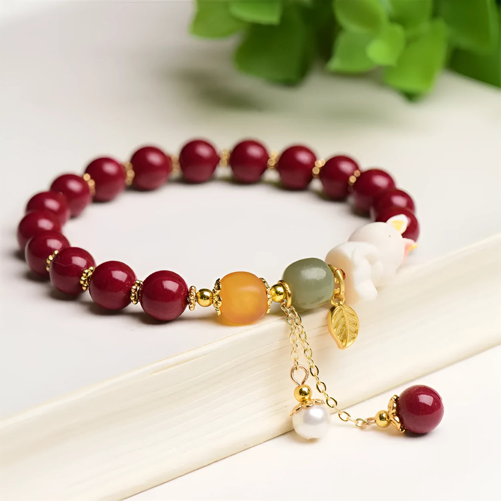 Natural cinnabar bracelet with rabbit design in purple gold sand colour, showing 8mm and 10mm bead size options.