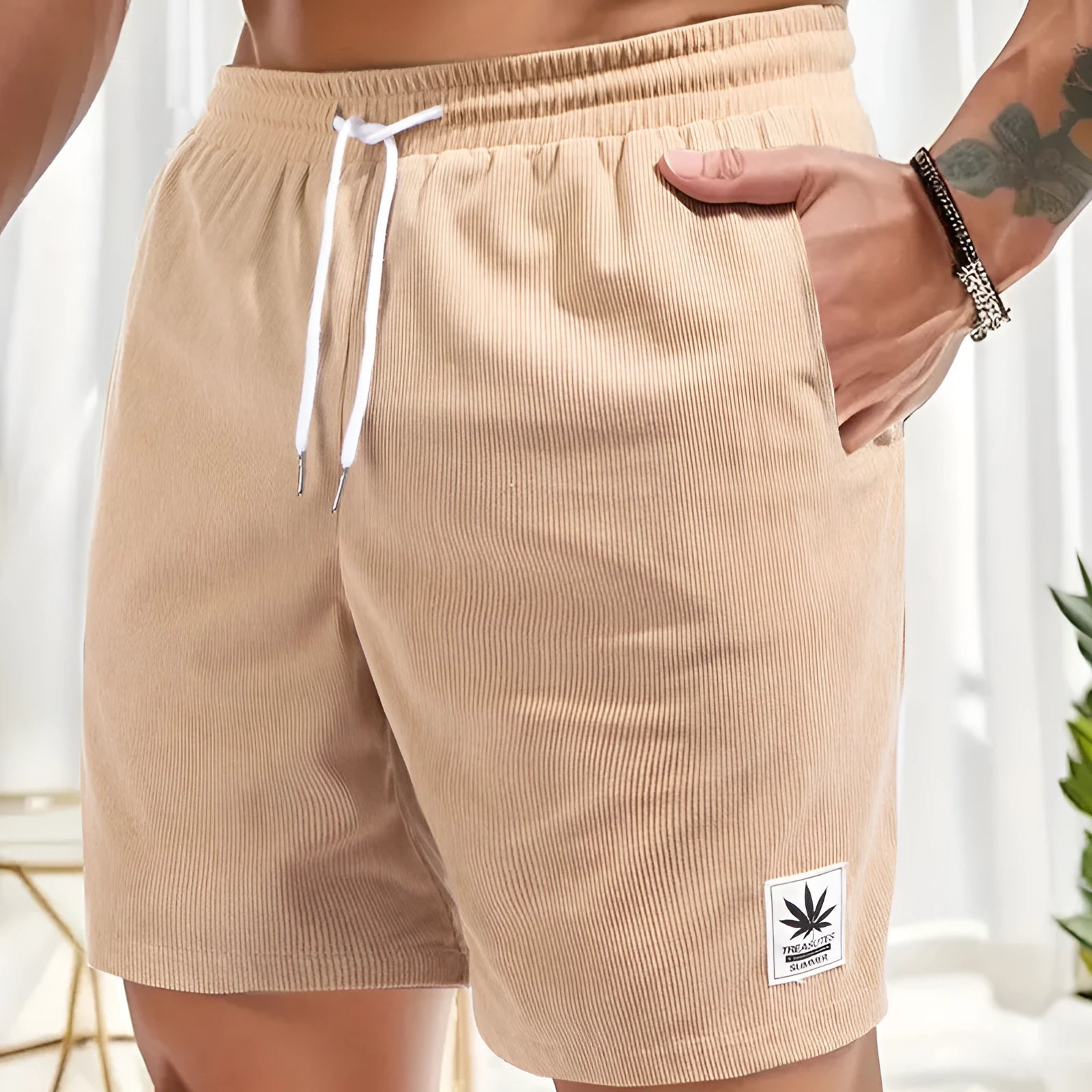 Men's grey drawstring summer shorts with elastic fabric on a mannequin
