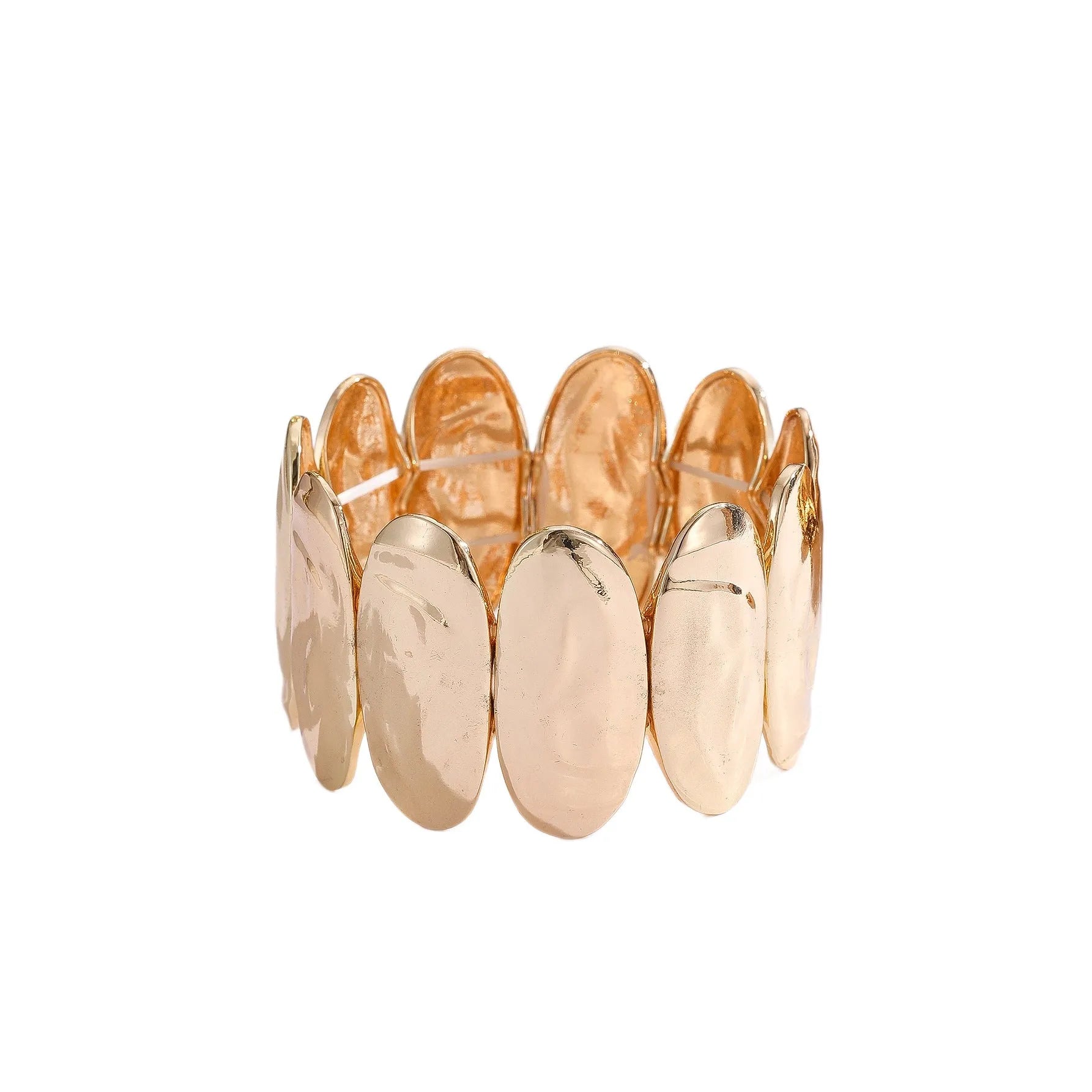 Gold exaggerated elliptical cuff bangle with 4mm band width on a neutral background