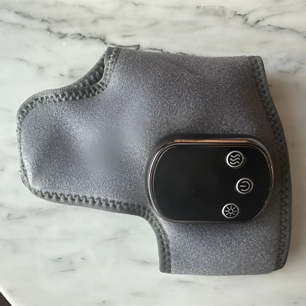 Grey USB electric heating ankle protector with joint massage and timing control, shown as a single unit.