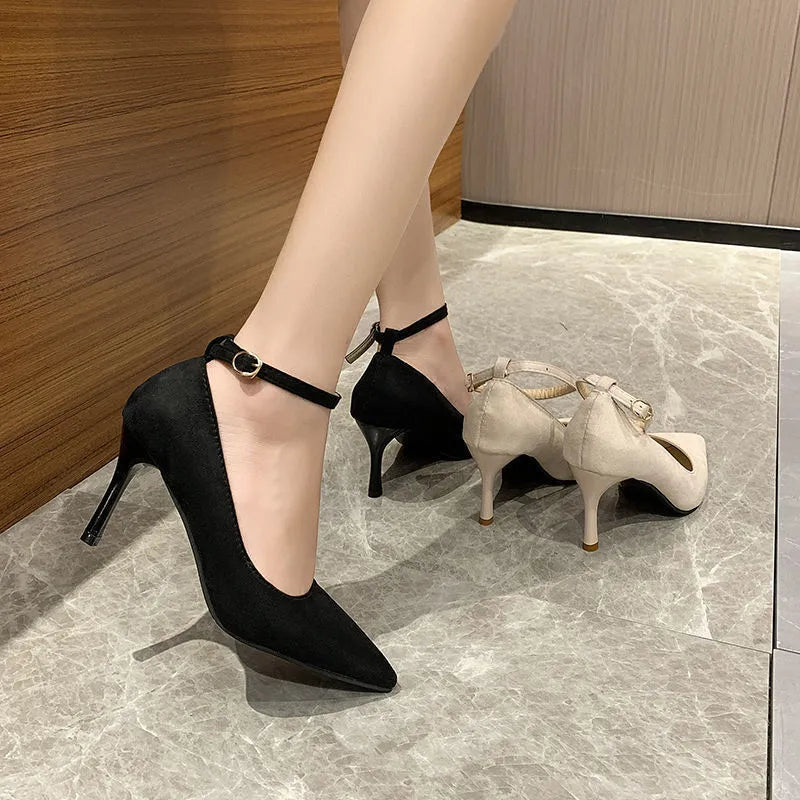 Women's black and creamy white stiletto heel shoes with buckle detail for graduation photos