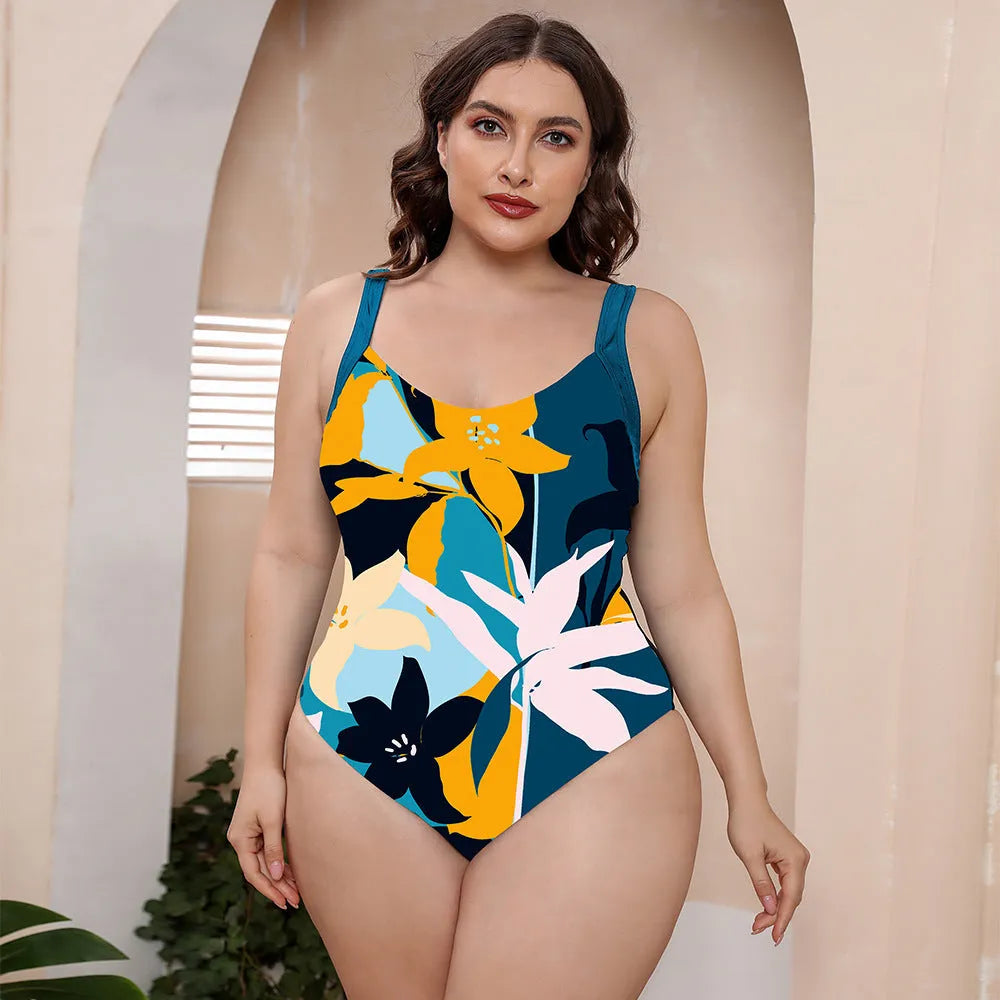 Conservative one-piece floral print swimsuit with spaghetti straps and vest top on a mannequin.