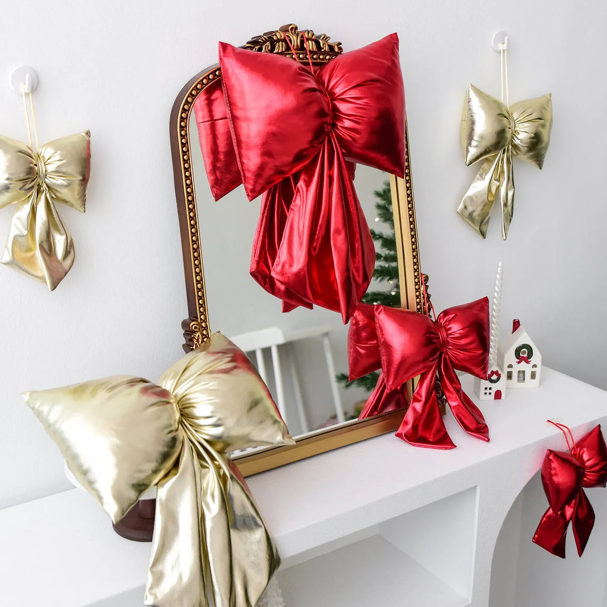 Christmas decorative bowknot with bright leather finish in red colour on a tree branch