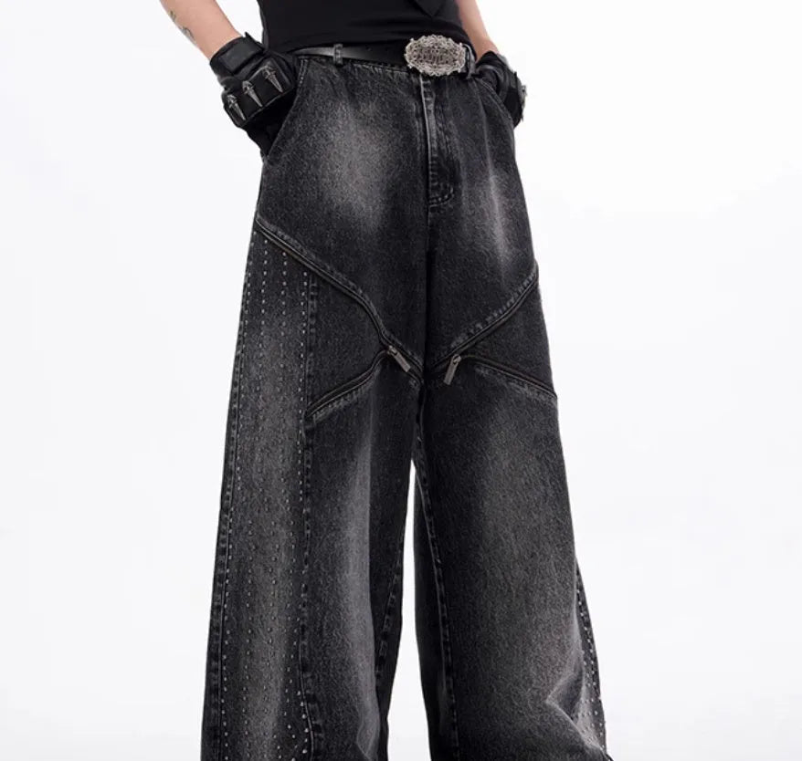 Black and grey washed wide leg cotton denim trousers and matching waistcoat set laid flat.