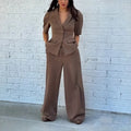 Brown men's two-piece slim fit suit separates showing top and trousers on a hanger