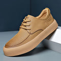 Men's brown casual lace-up platform shoes with a round toe and flat heel on a white background.