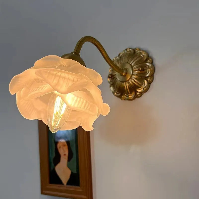 Retro copper wall lamp with frosted glass shade and warm LED light mounted on a bedroom wall