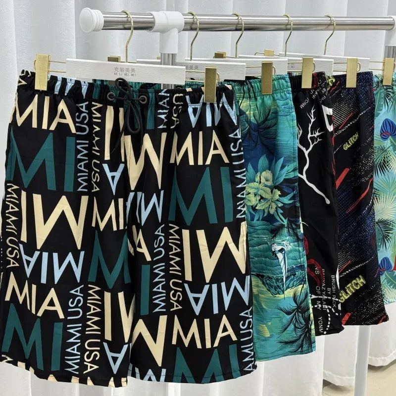 Men's loose beach trousers in ice silk fabric with striped pattern, elastic waist, and quick-drying properties