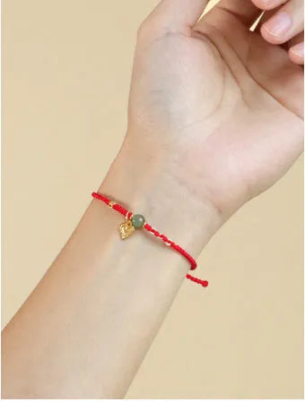 Handmade women's 925 silver and Hetian jade woven bracelet with red carrying strap